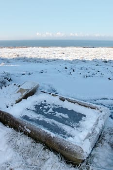 frozen animal feeder on a frosty blue winters day on ballybunion cliffside walk