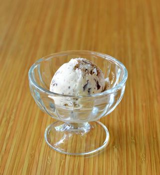 Vanilla ice cream in bowl with chocolate chips
