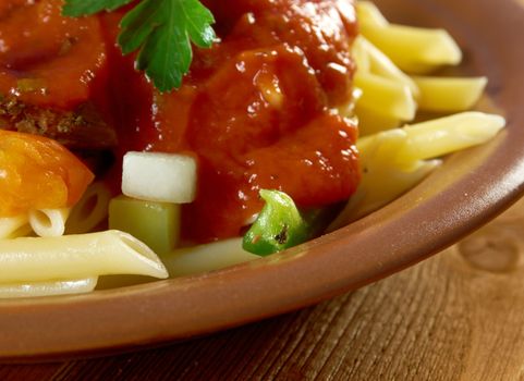  pasta with tomato beef sauce  on wooden table