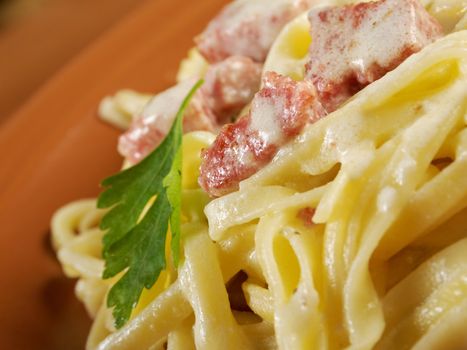 pasta Fettuccine Alfredo with sausage. close-up