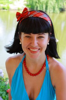 portrait of a women in the red necklace 