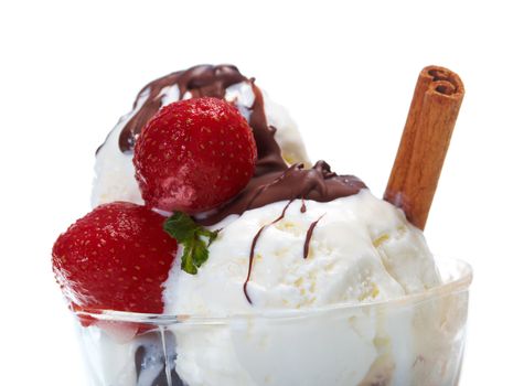 ice cream  with chocolate sauce and strawberries,cinnamon. closeup.isolated on white background.
