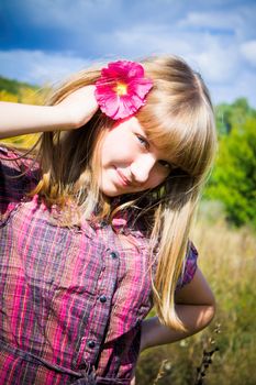 pretty girl with pink flower in her hair