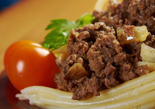  pasta with  beef on wooden table