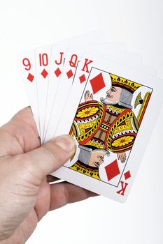 some cards of poker on a human hand