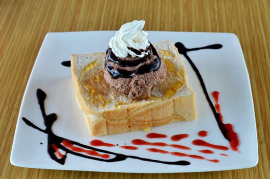 Honey toast  and whipping cream with chocolate ice cream