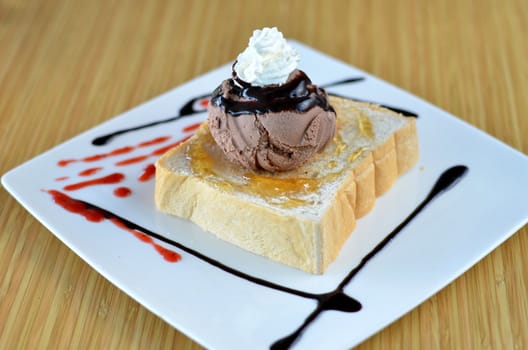 Honey toast  and whipping cream with chocolate ice cream