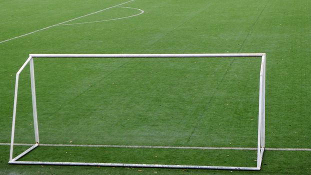 Soccer goal in the green field