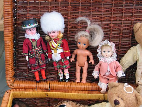 Selection of handmade dolls and figurines in a flea market