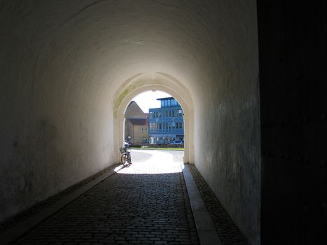 Dark street tunnel - light at the end