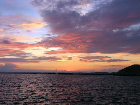 Beautiful dramatic sunset with colorful cloudscape Assens Denmark