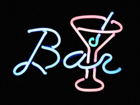 Neon bar martini cocktail sign on black background