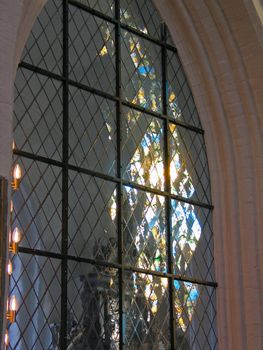 Church Stained Glass Window with Light Reflection