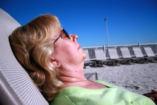 Carole sunbathing in Florida, relaxing in the sun.