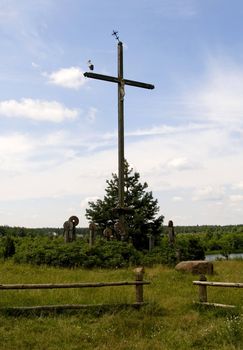 the stork is standing on cross