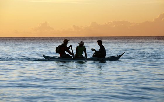 Sailing with a beautiful sunset in a tropical place