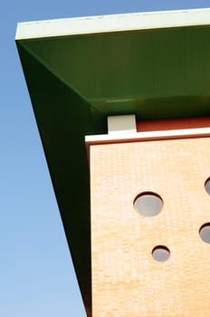 Roof of a modern building against blue sky