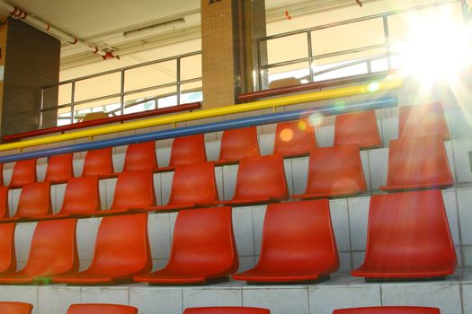 Stadium chairs under sunlight
