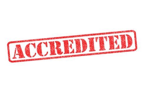 ACCREDITED rubber stamp over a white background.