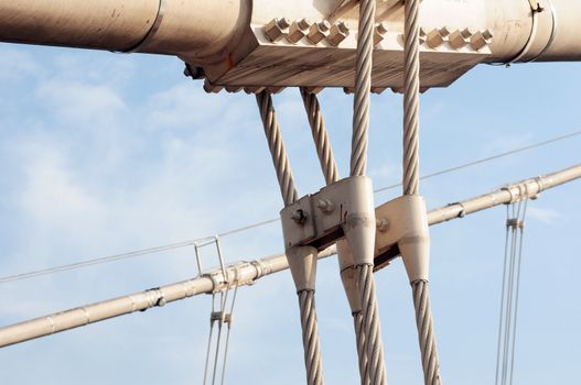 Steel cable structure for a bridge against blue sky