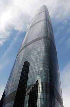 Landmark of modern skyscraper against blue sky