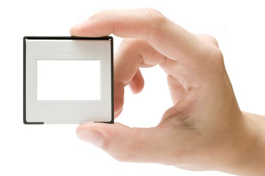 Female hand holding a plastic picture slide frame. Isolated on a white background.