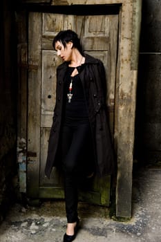 Women model in black hair and black coat.