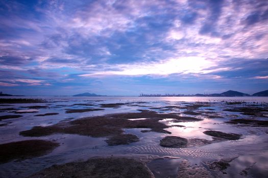 Sunset in Hong Kong along sea shore at dusk 