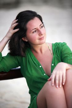 The beautiful girl enjoys a decline on a beach