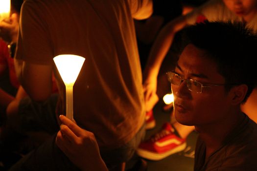 HONG KONG - JUN 4, It is the commeoration of the 22nd aniversary of the Tiananmen massacre at 4 June, 2011 in Victoria Park, Hong Kong. Everyone has a candle provided by Hong Kong Alliance.