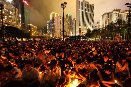 HONG KONG - JUN 4, Tens of thousands of people packed Victoria Park last night with candles to mourn those who died in the crushing of pro-democracy protests in Tiananmen Square in 1989 on 4 June, 2011. It is an annual event.