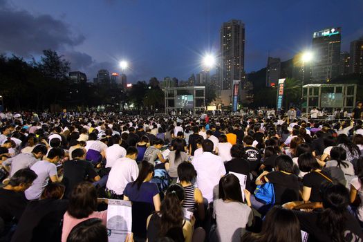 HONG KONG - JUN 4, Tens of thousands of people packed Victoria Park last night with candles to mourn those who died in the crushing of pro-democracy protests in Tiananmen Square in 1989 on 4 June, 2011. It is an annual event.