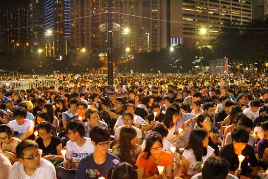 HONG KONG - JUN 4, Tens of thousands of people packed Victoria Park last night with candles to mourn those who died in the crushing of pro-democracy protests in Tiananmen Square in 1989 on 4 June, 2011. It is an annual event.