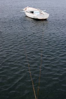 A wooden rowing boat tide down