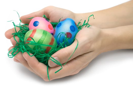 Female hands holding an easter nest. Isolated on a white background.