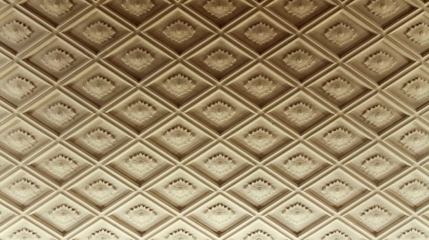 Diamond plaster moldings on the ceiling texture