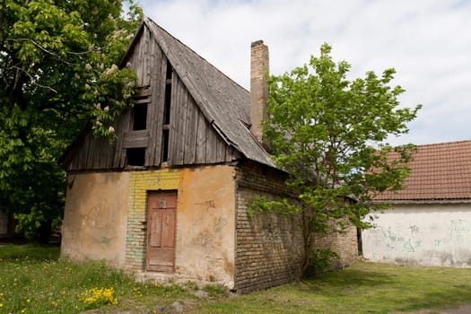 A abandoned house with breaked roof side