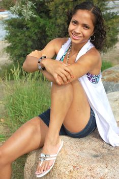 African american female fashion model posing outdoors.