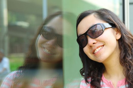 Portrait of young Asian woman outdoors. Shallow DOF.