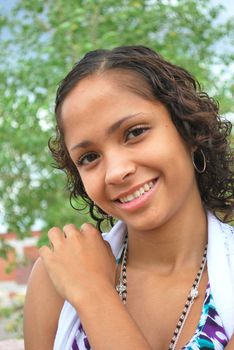 African american female fashion model posing outdoors.