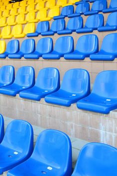 Stadium seats in blue and yellow color