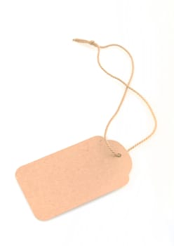 Blank recycled gift tag tied with string to write own message