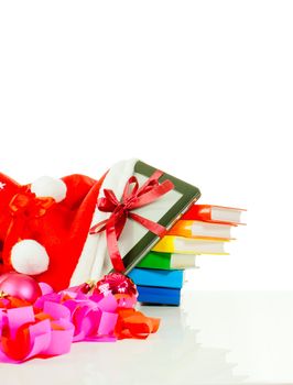 Electronic book reader with stack of books in bag against white background