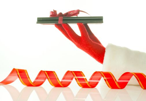 Hand in red glove holds electronic book reader against white background