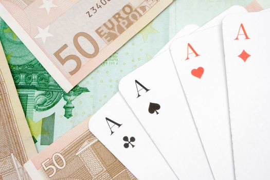 Game cards lying on Euro banknotes.