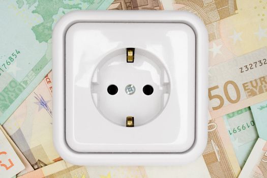 Power socket isolated on a money background.