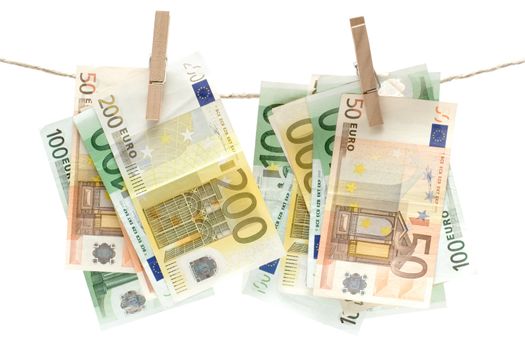 Several different euro banknotes held by a clothesline. Isolated on a white background.