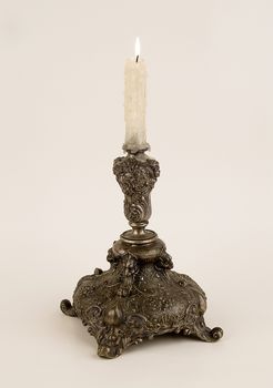 Bronze candlestick. Is used to illuminate the premises