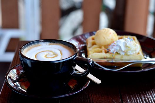 hot coffee served with waffle and icecream