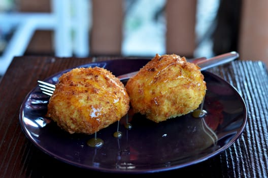 deep fried bread served with honey sauce